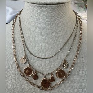 Goldtone faux coin triple strand necklace